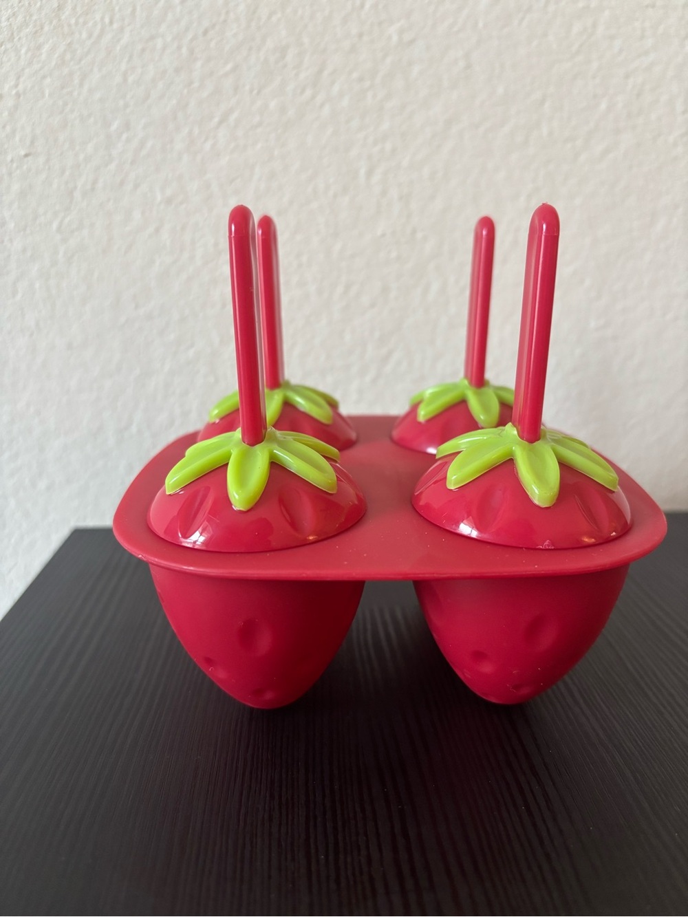 Joie Red strawberry-shaped popsicle molds with green leaf tops